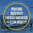 Conference graphic: blue circular badge reading event title, city skyline, airplane and wind turbine.